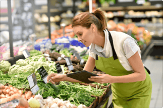 woman checking food at a grocery store - food quality assurance